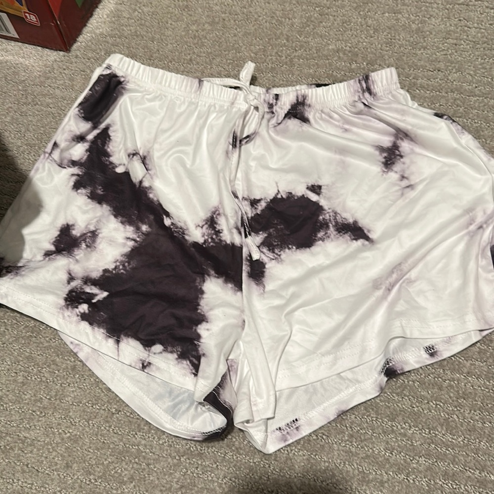 White and black tie dye shorts.